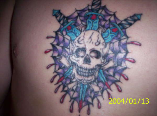 skull on chest tattoo