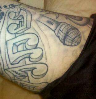 Armpit Microphone & Music Notes to "Sun is Shining" by Marley tattoo