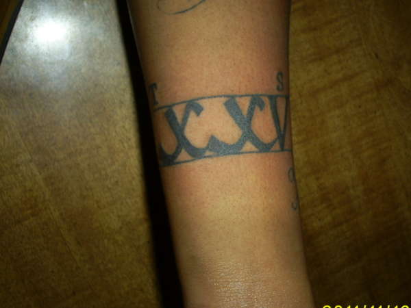 D.O.D. in Roman Numerals tattoo