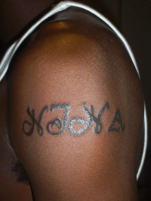 Name on Upper Arm tattoo