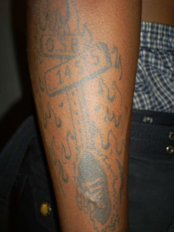 Skeletons on the block w/ flame background tattoo