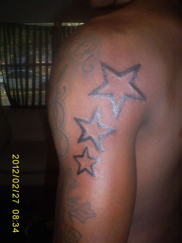 Stars on back of arm ( arm 1) tattoo