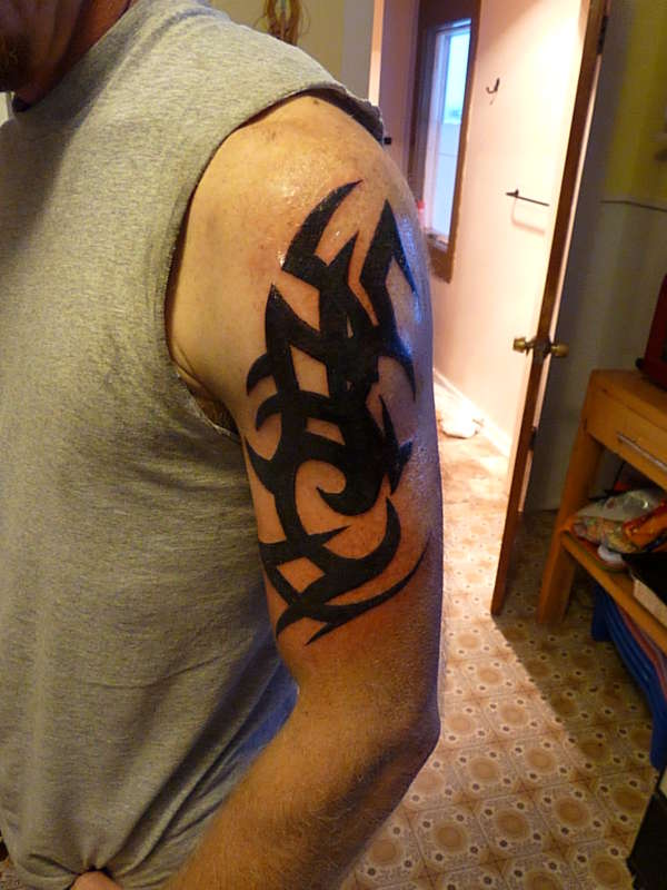 tribe arm tattoo
