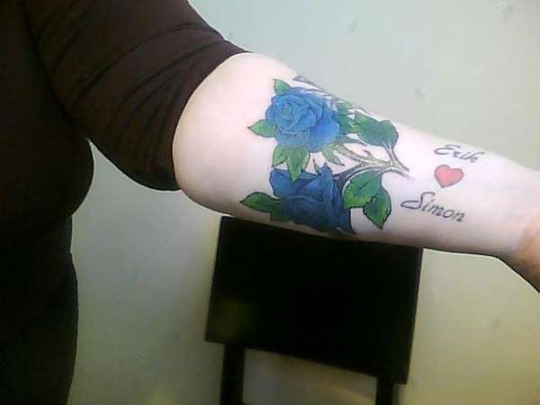 multi colored blue rose with raindrop tattoo