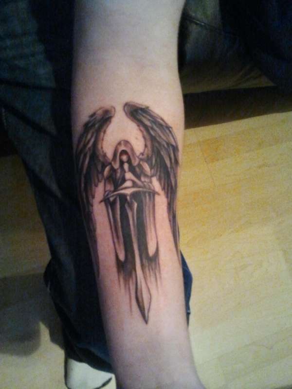 Evil angel tattoo