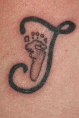 Foot Initial tattoo