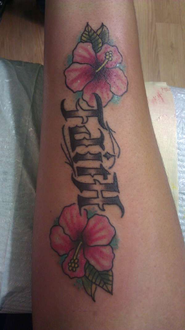 faith tattoo on forearm