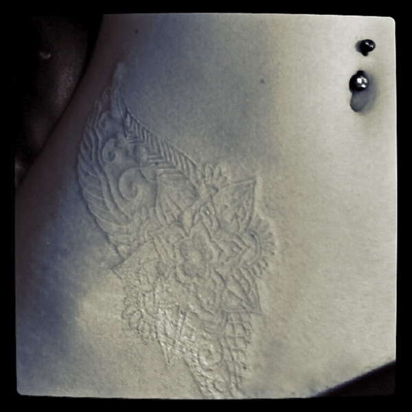 White Ink Lotus flower tattoo