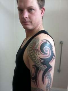 cobra with tribal arm tattoo