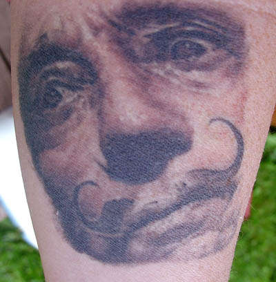 Dali Face tattoo