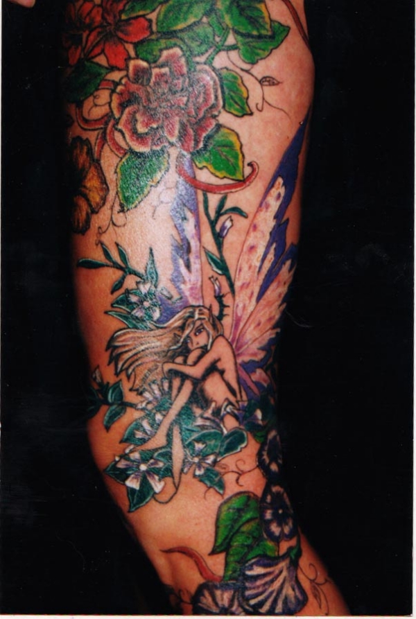 brimstone amy brown and flower leg tattoo