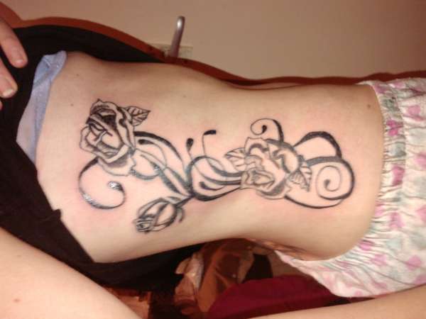 roses and swirls tattoo