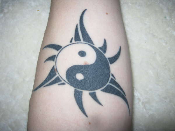tribal sun and yin yang tattoo