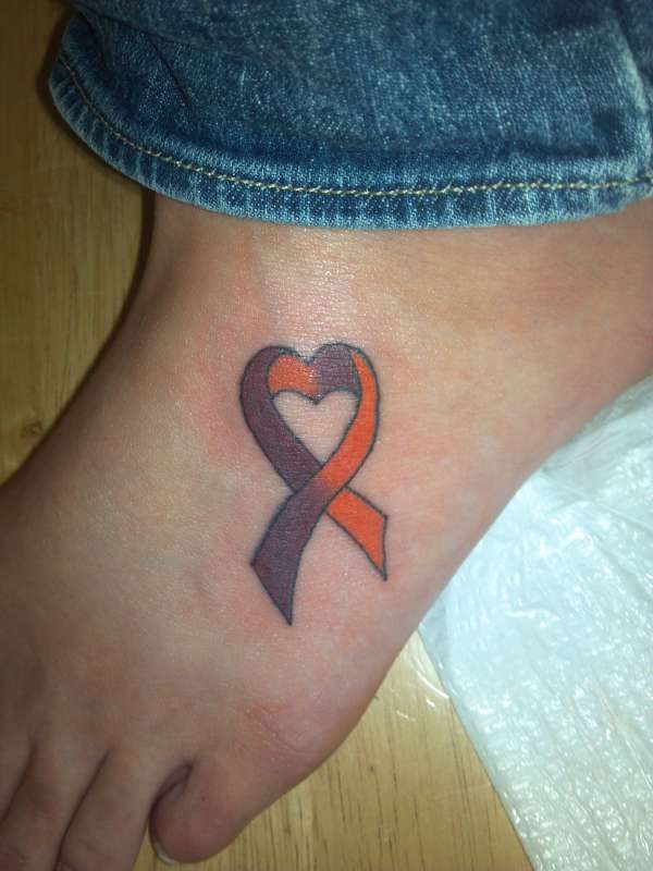 Cancer ribbon foot tattoo