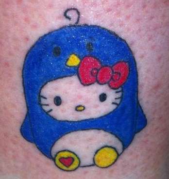 Hello Kitty In A Penguin Suit tattoo
