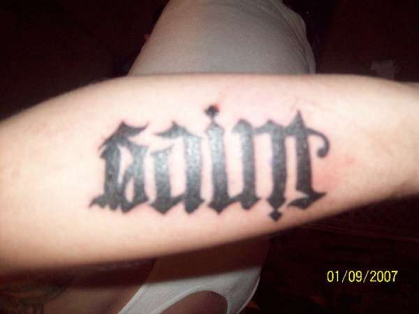 Sinner/Saint Ambigram tattoo