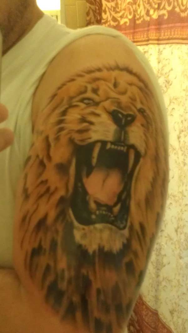 angry lion tattoo
