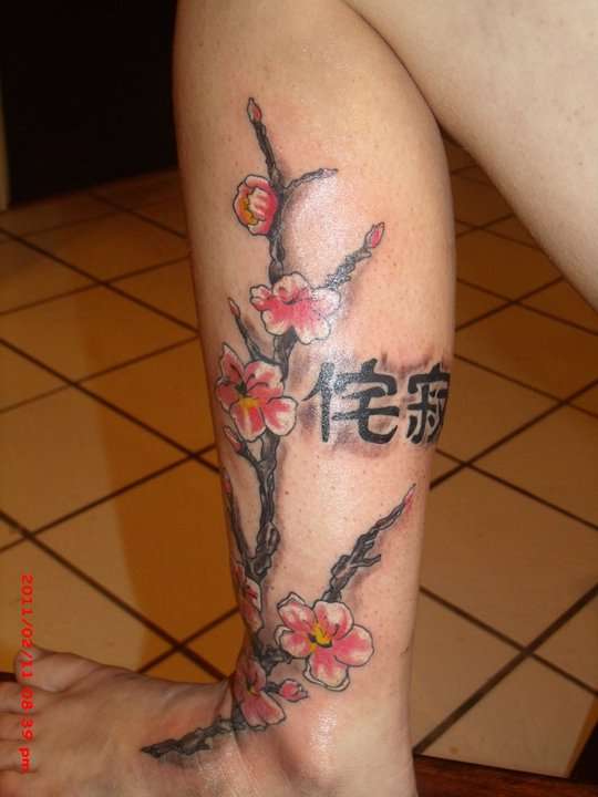 dog wood flowers tattoo