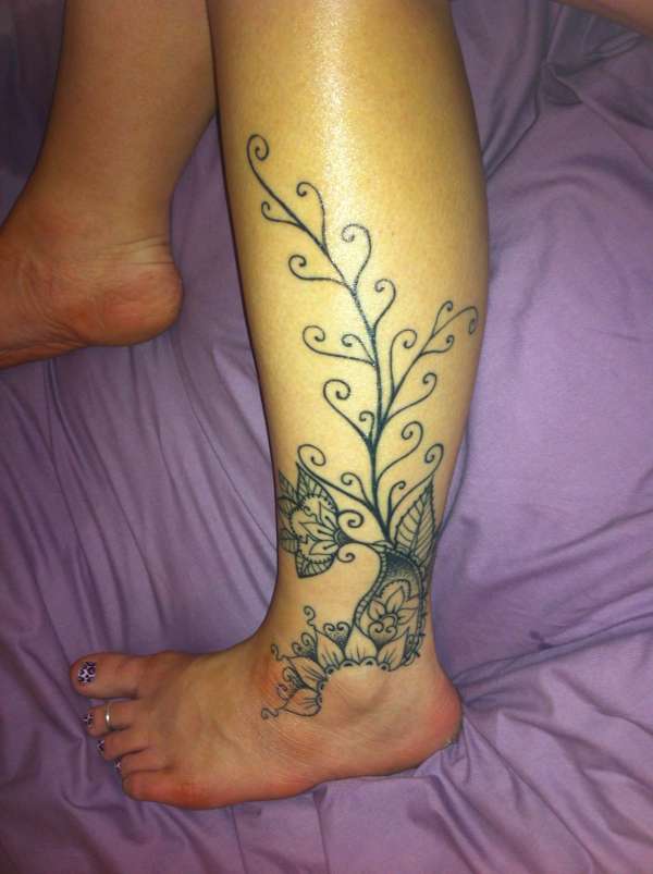 left calf flowers tattoo