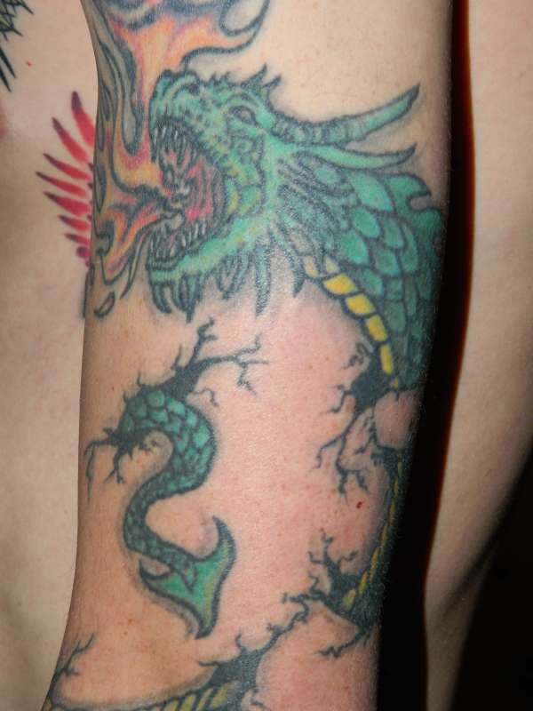 my dragon tear wrap around tattoo