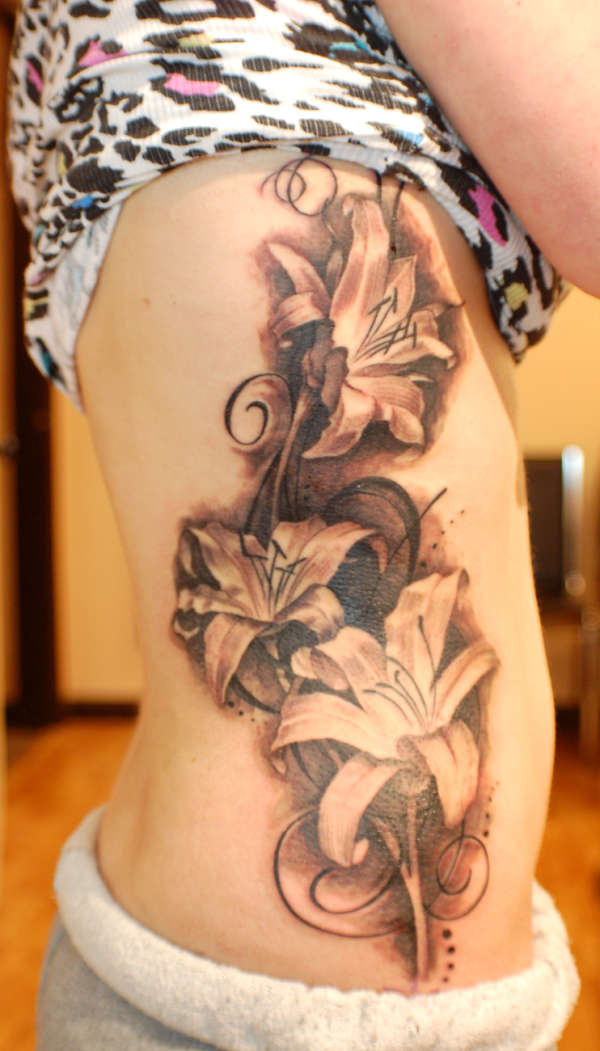 rib flowers tattoo