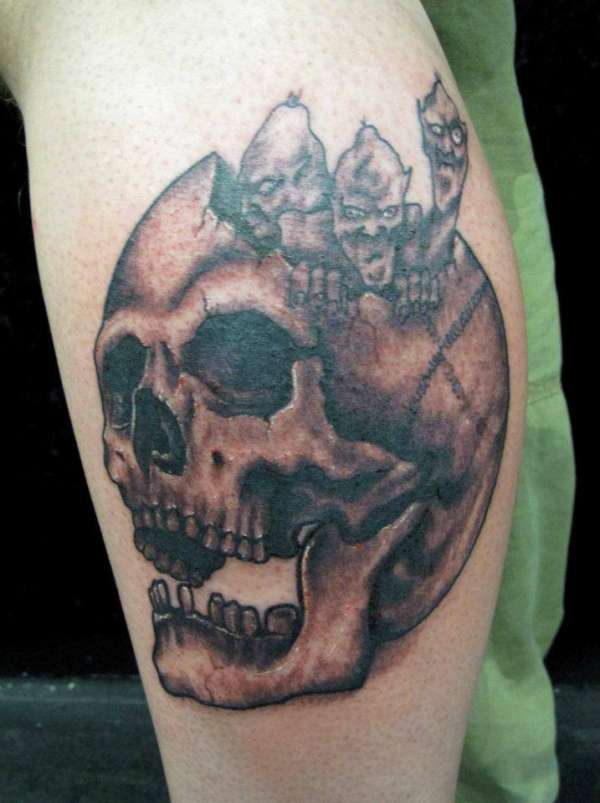 skull and creatures tattoo