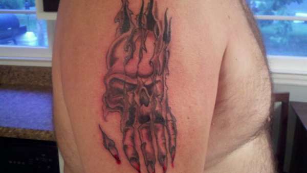 skull ripping flesh tattoo