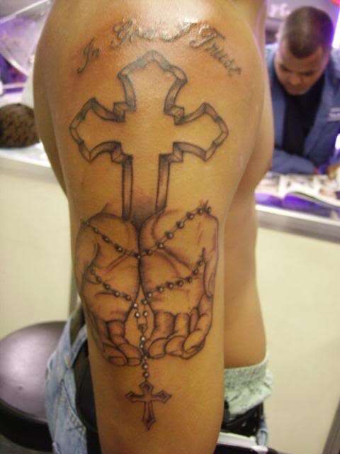 Hands holding a Rosary tattoo