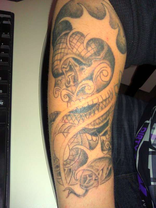 Skull with snake and waves tattoo