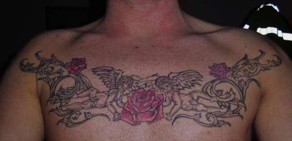 cherubs and filgree aross chest tattoo