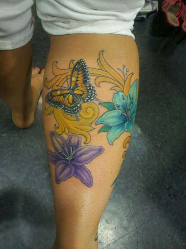 Lily flower and butterfly tattoo