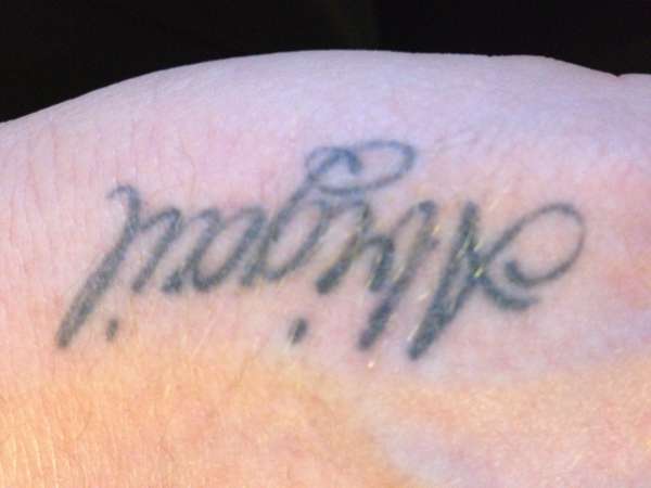 my daughters name on left hand tattoo