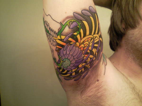 quarter element skull sleeve tattoo