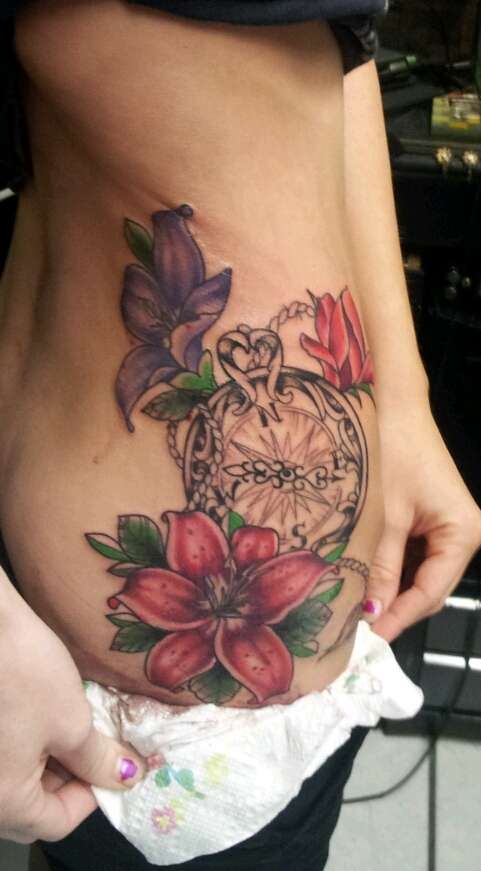 Compass with lilies tattoo
