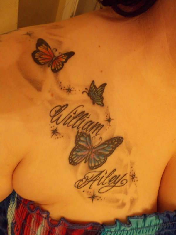 butterflies with kids names (chest) tattoo