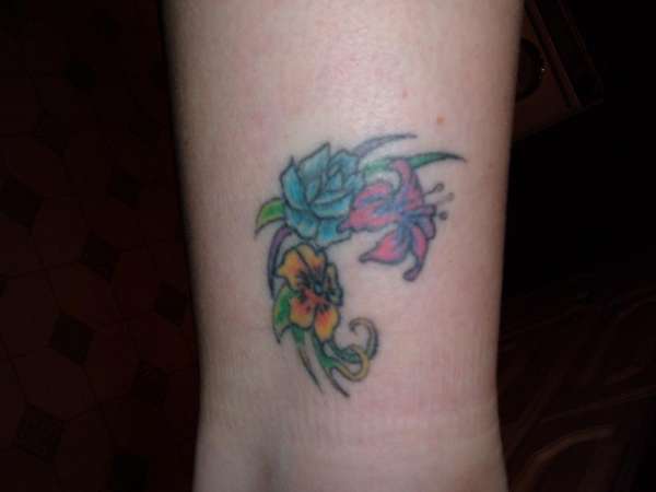 flowers on right ankle tattoo