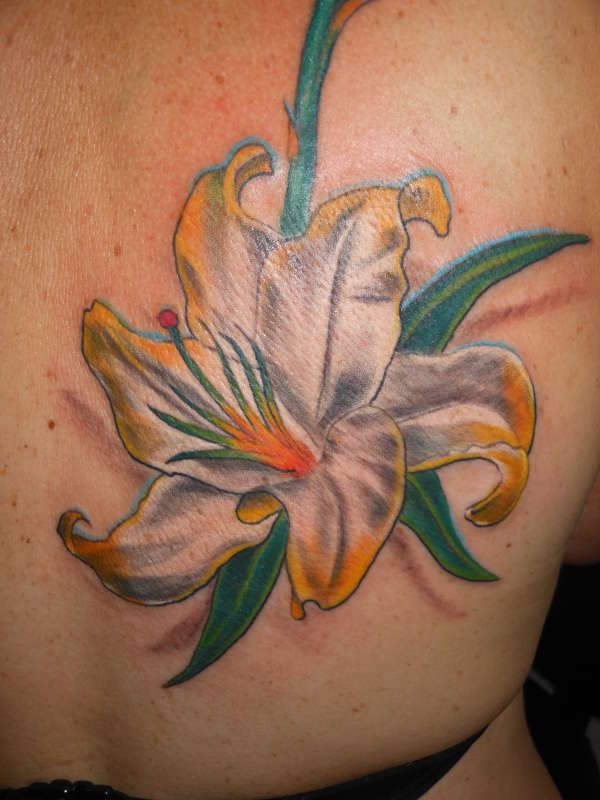 lilly tattoo by lex colins tattoo