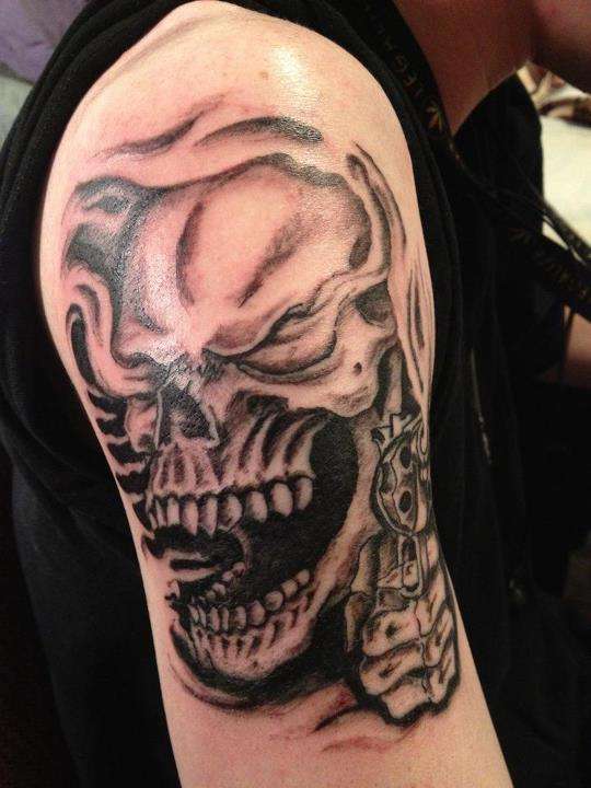 skull and revolver tattoo