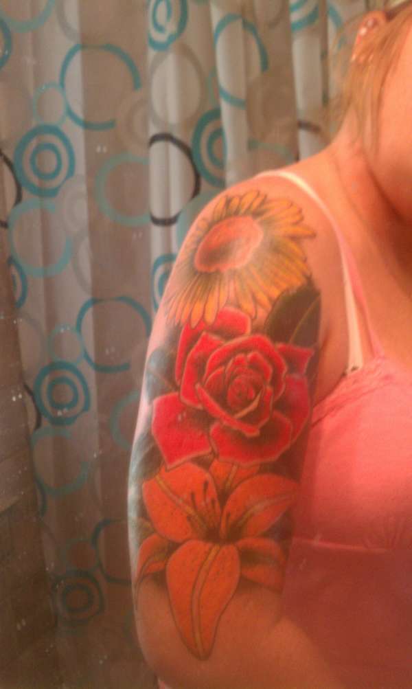 Colorful flower arm sleeve tattoo