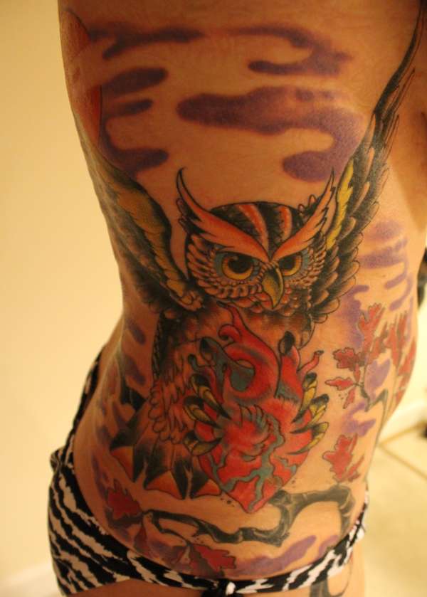 Owl on ribs tattoo