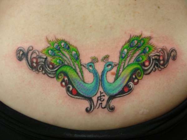 Peacocks tattoo