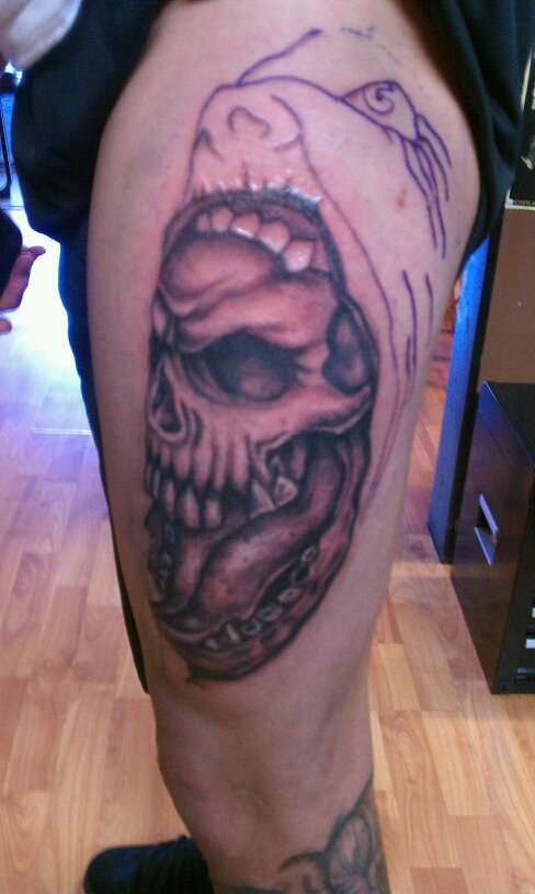 Skull With face not finished tattoo