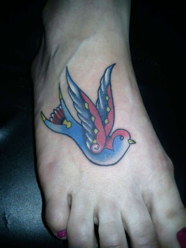 Swallow tattoo on foot tattoo