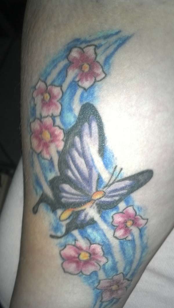 Butterfly and flowers in the wind. tattoo