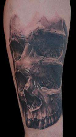Double eye skull tattoo