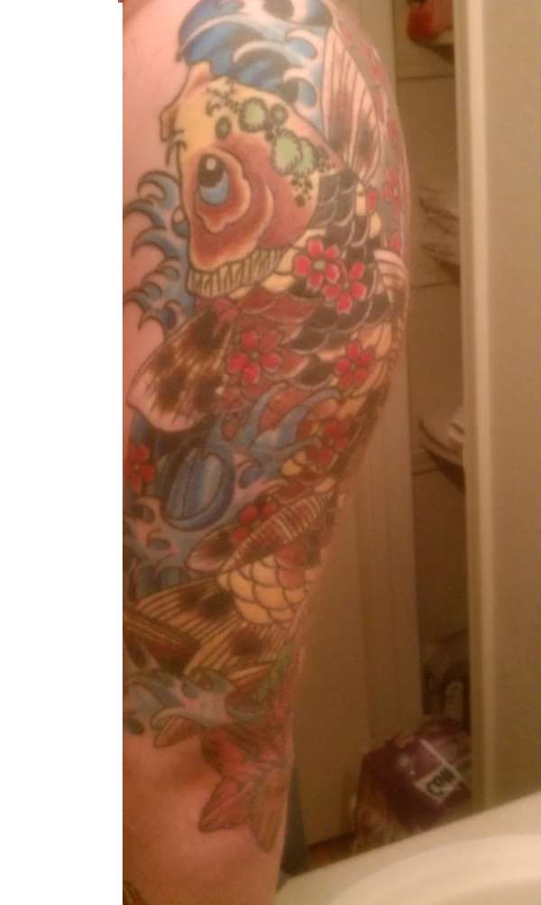 Koi swmming upstream tattoo