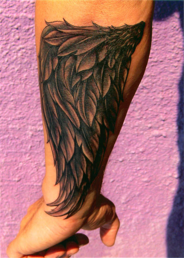 black and grey wing tattoo