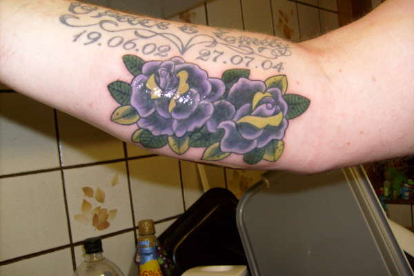 flower and my girls names tattoo