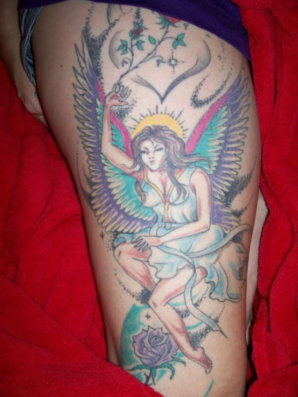 Angel on thigh tattoo