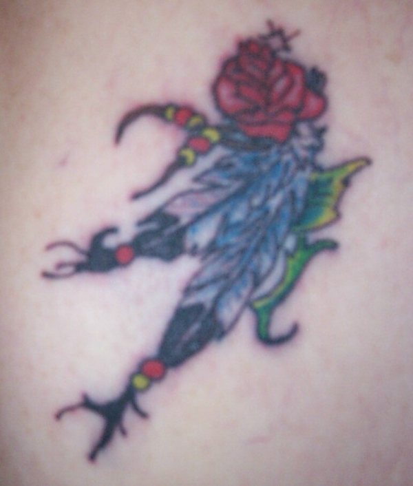 feathers and roses tattoo